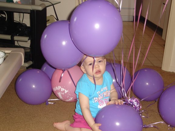 Jenna plays with balloons.
